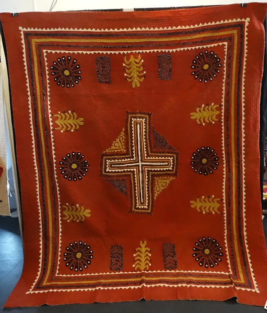 Handcrafted quilt in Earth tones with cross