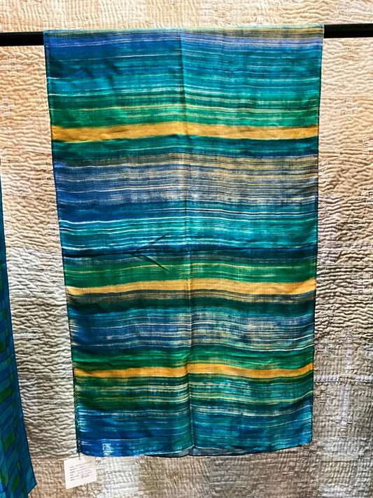 Silk scarf in greens, blues and yellows